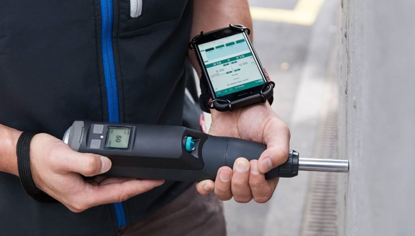 Original Schmidt Live Type L Concrete Test Hammer shown with Schmidt Live app for iOS